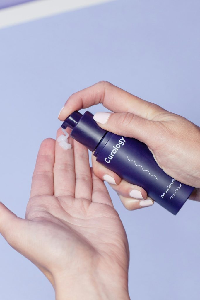 person-holding-curology-spray-bottle-vitxz6u036u